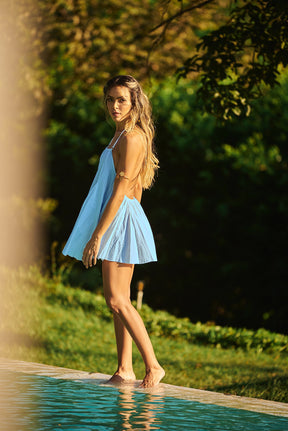 Stay cool and stylish in a baby blue Lonarc cotton short dress by the pool