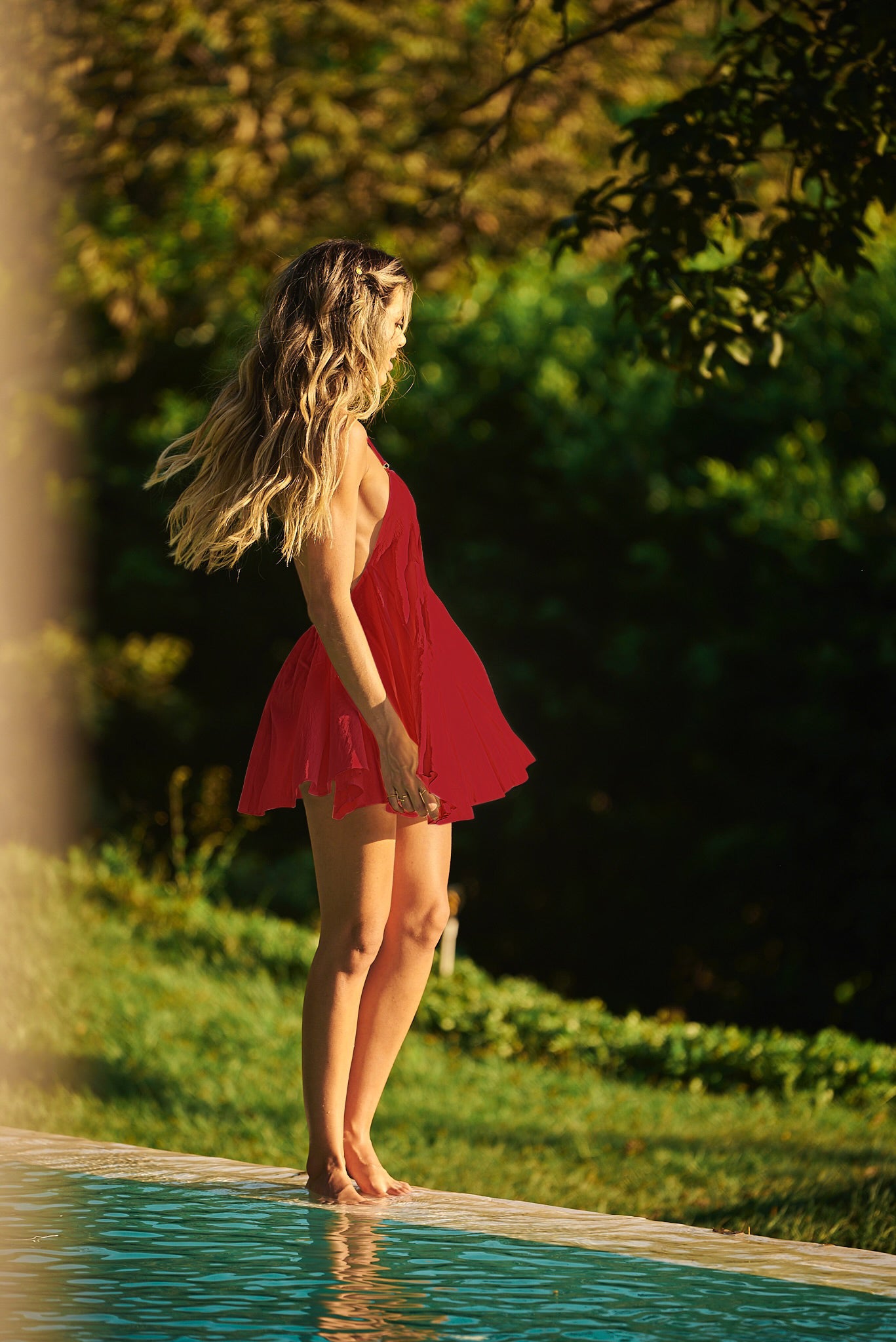 Stay cool and stylish in a red Lonarc cotton short dress by the pool